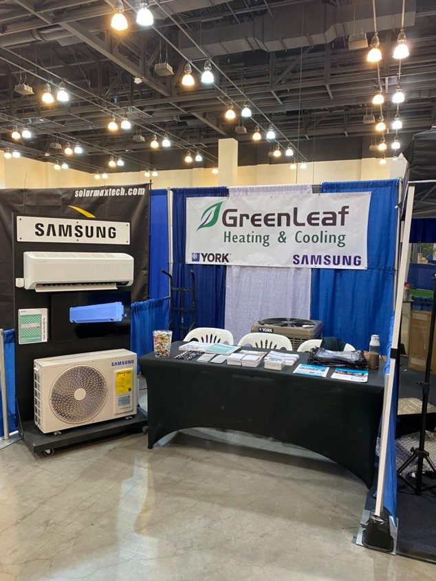 A greenleaf heating and cooling booth at a convention.