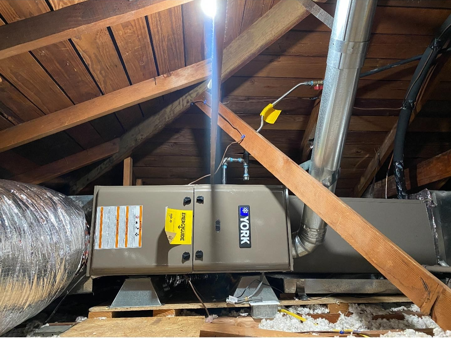 A york air conditioner is installed in the attic of a house.