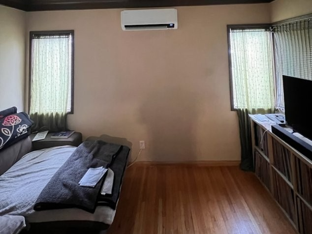 A living room with a couch and a television