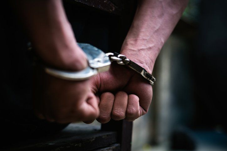 Man on the chair in Handcuffs