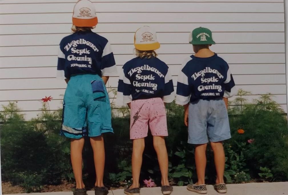 Children with Cap Wearing a Blue Shirt — Malone, WI — Ziegelbauer Septic Service LLC