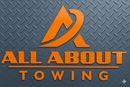 Orange &ldquo;All About Towing&rdquo; logo on dark gray diamond-plate background