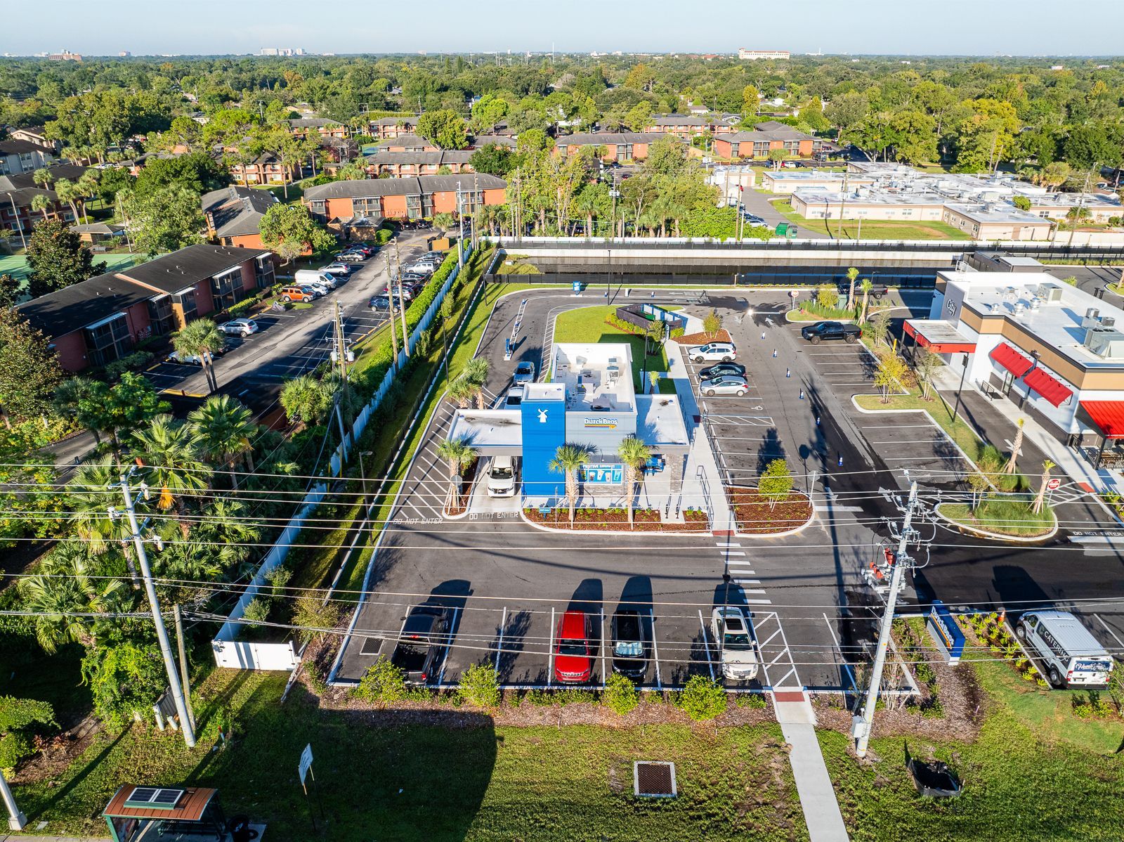 An aerial view of a parking lot in a residential area.
