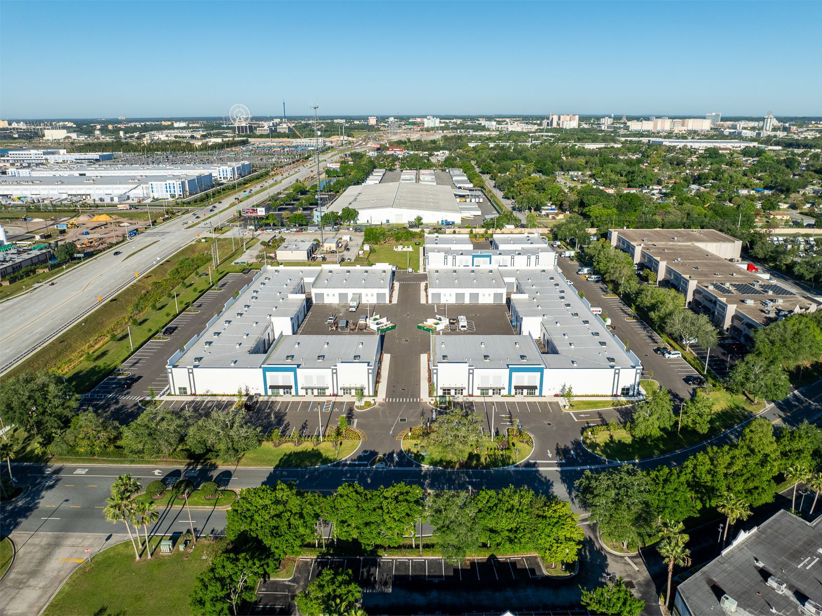 An aerial view of a large building surrounded by trees.