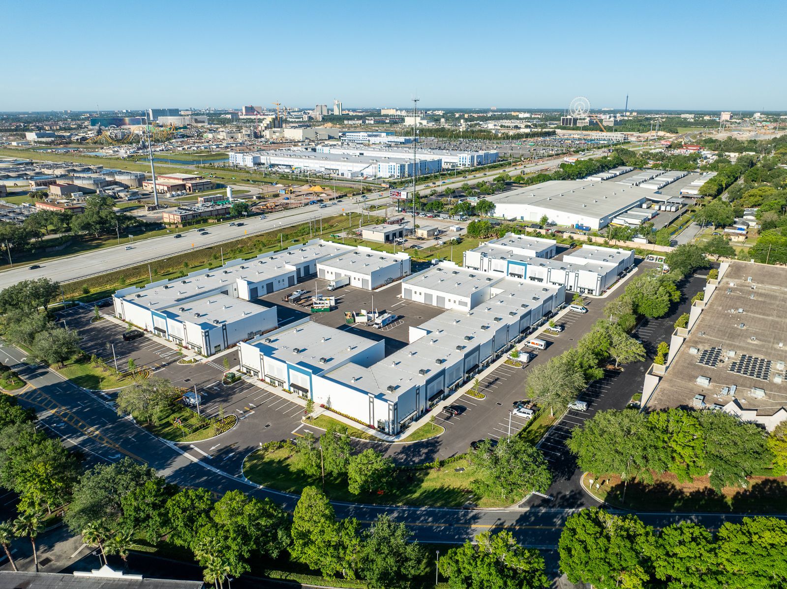 An aerial view of a large industrial area with lots of buildings and trees.