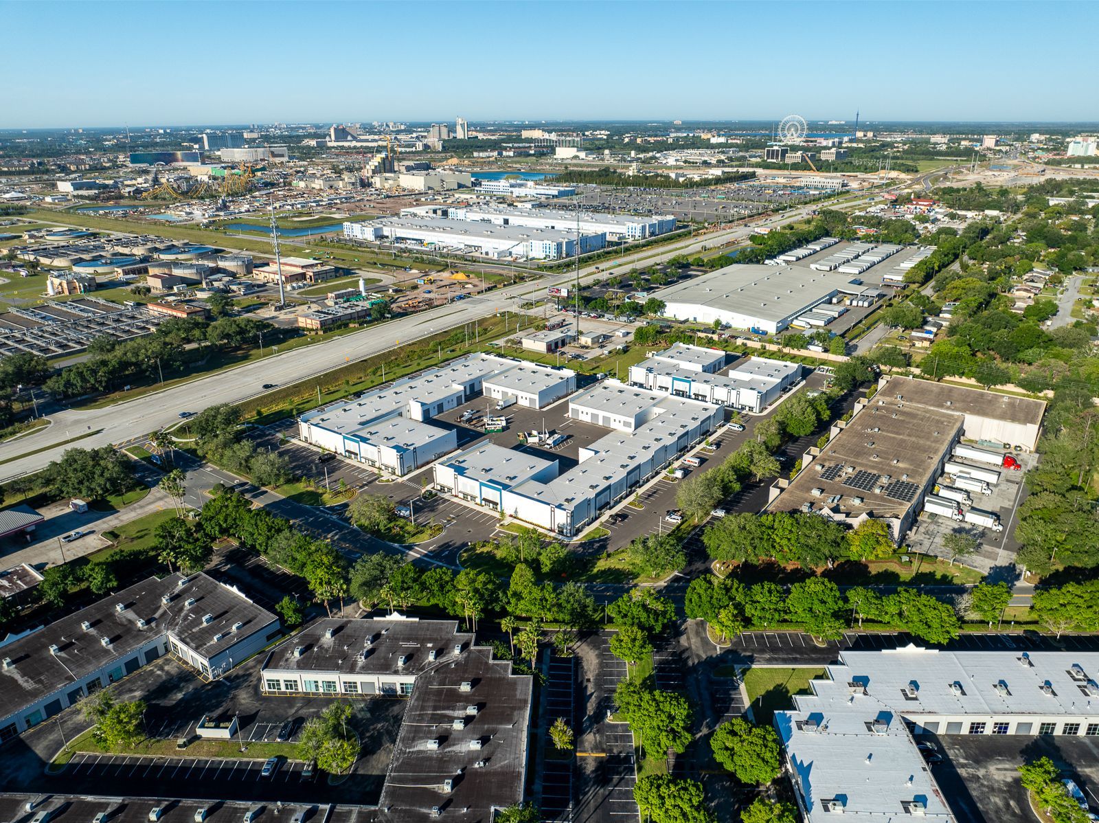 An aerial view of a city with lots of buildings and trees.