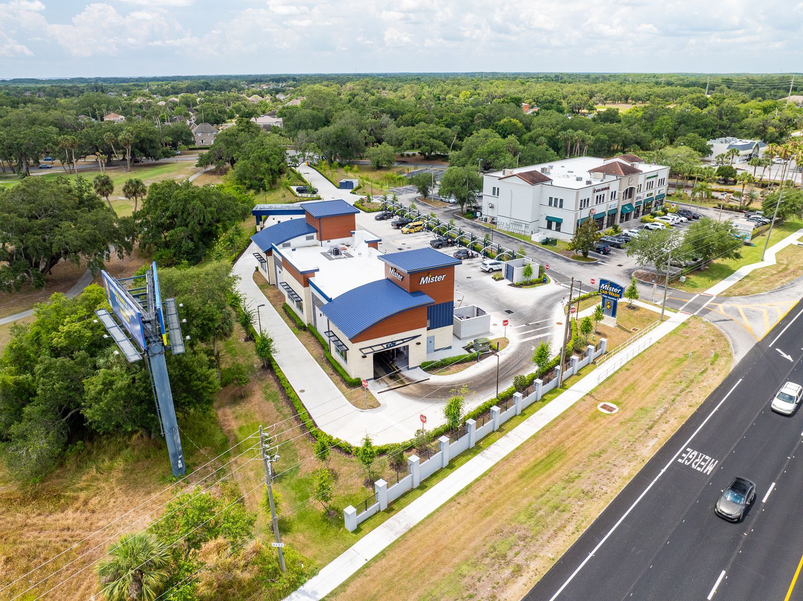 An aerial view of a building next to a road.