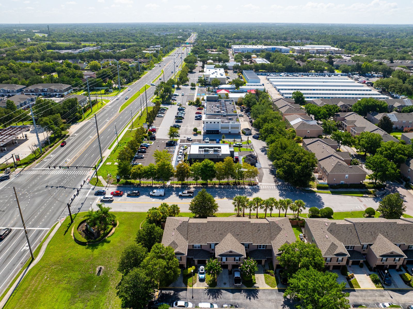 An aerial view of a city with a lot of buildings and trees.