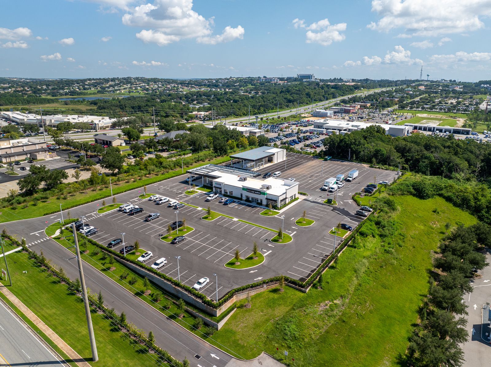 An aerial view of a large parking lot in a city.