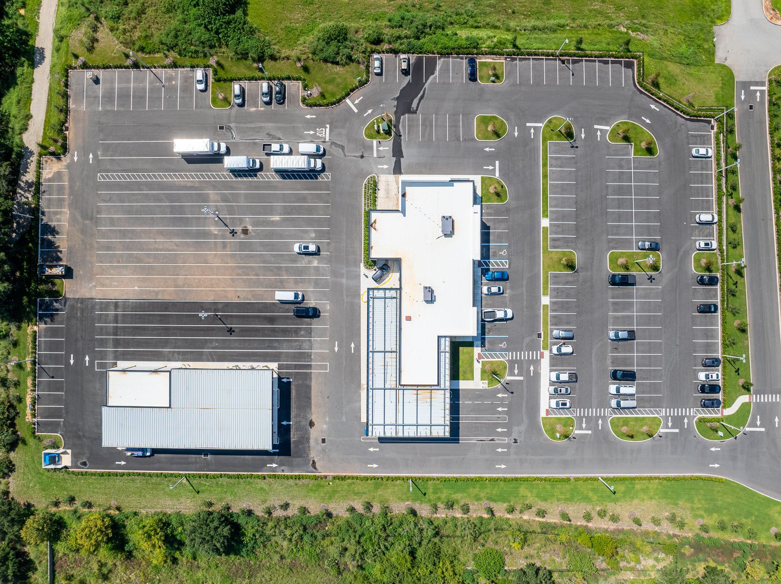 An aerial view of a parking lot and a building