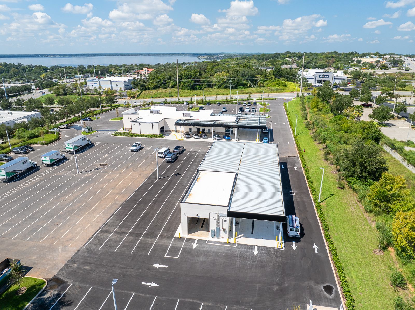 An aerial view of a parking lot with cars parked in it