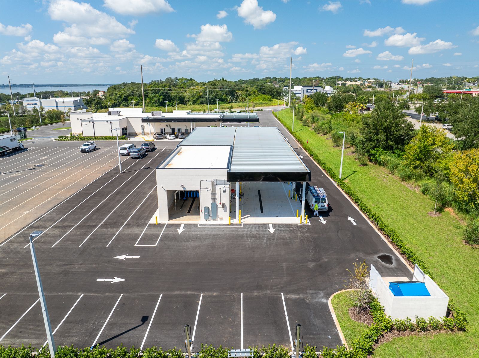 An aerial view of a car wash in a parking lot