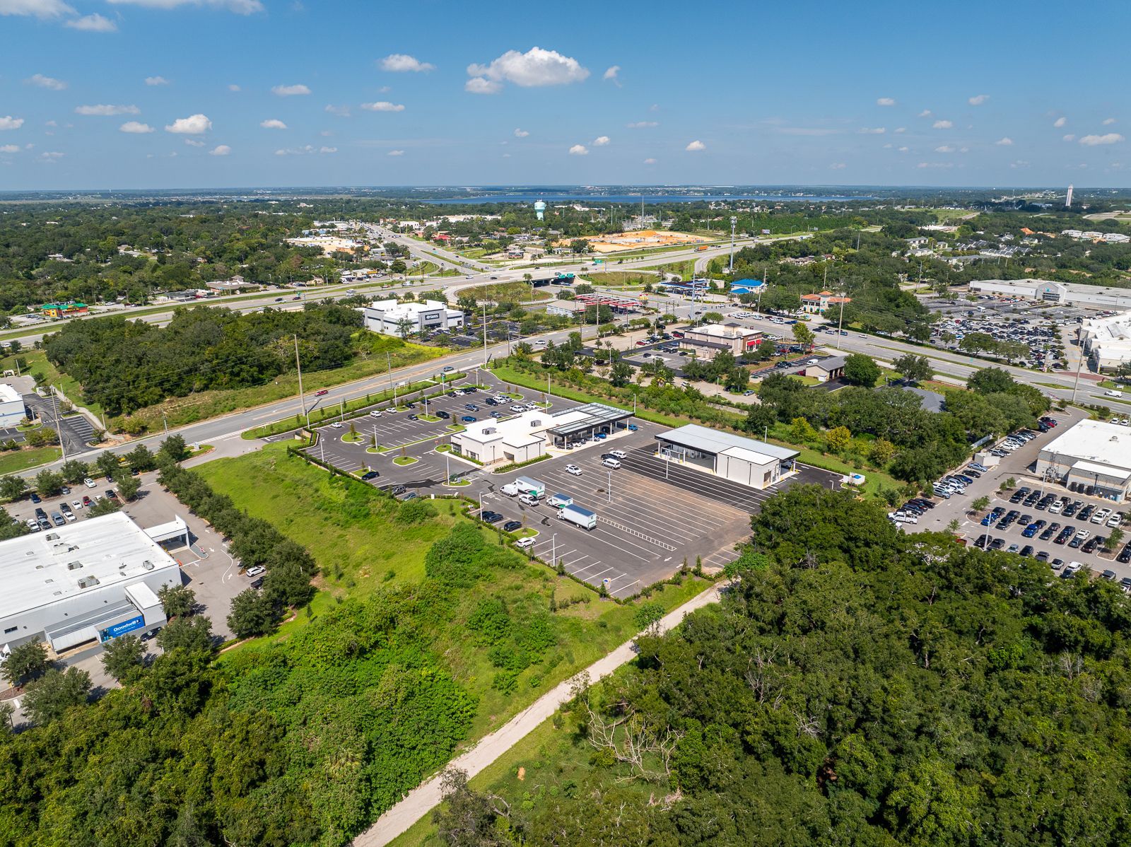 An aerial view of a city with a lot of trees and buildings.