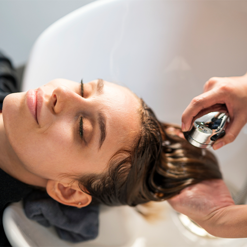 Adding Shampoo on Hair — Baltimore, MD — Baltimore Beauty & Barber School
