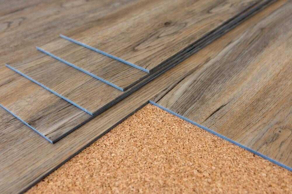 Planks of Wood-Look Flooring Are Being Installed Over Cork Underlayment — Gava Floor Centre In Goonellabah, NSW