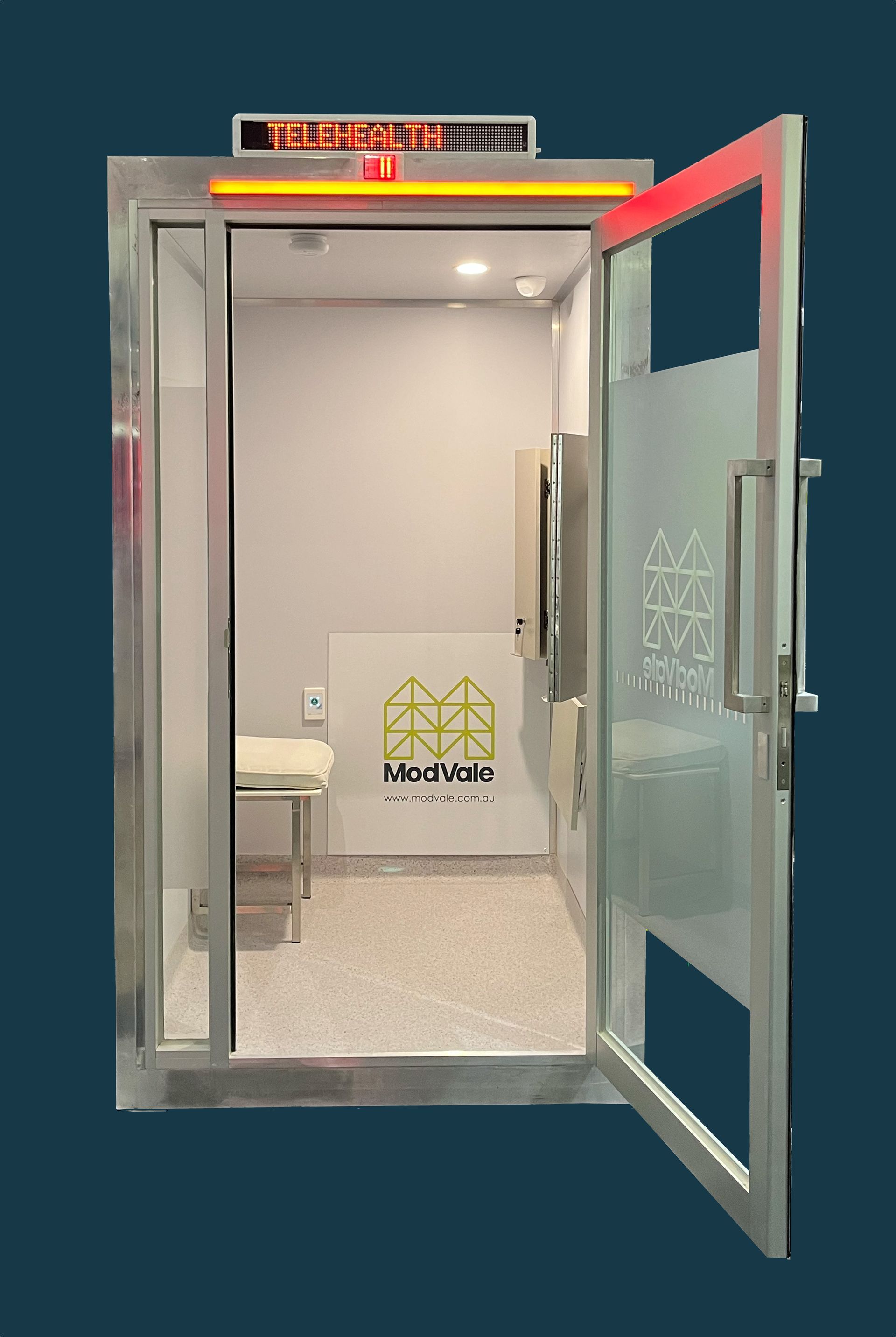 A glass door is open to a room with a sign on the wall.