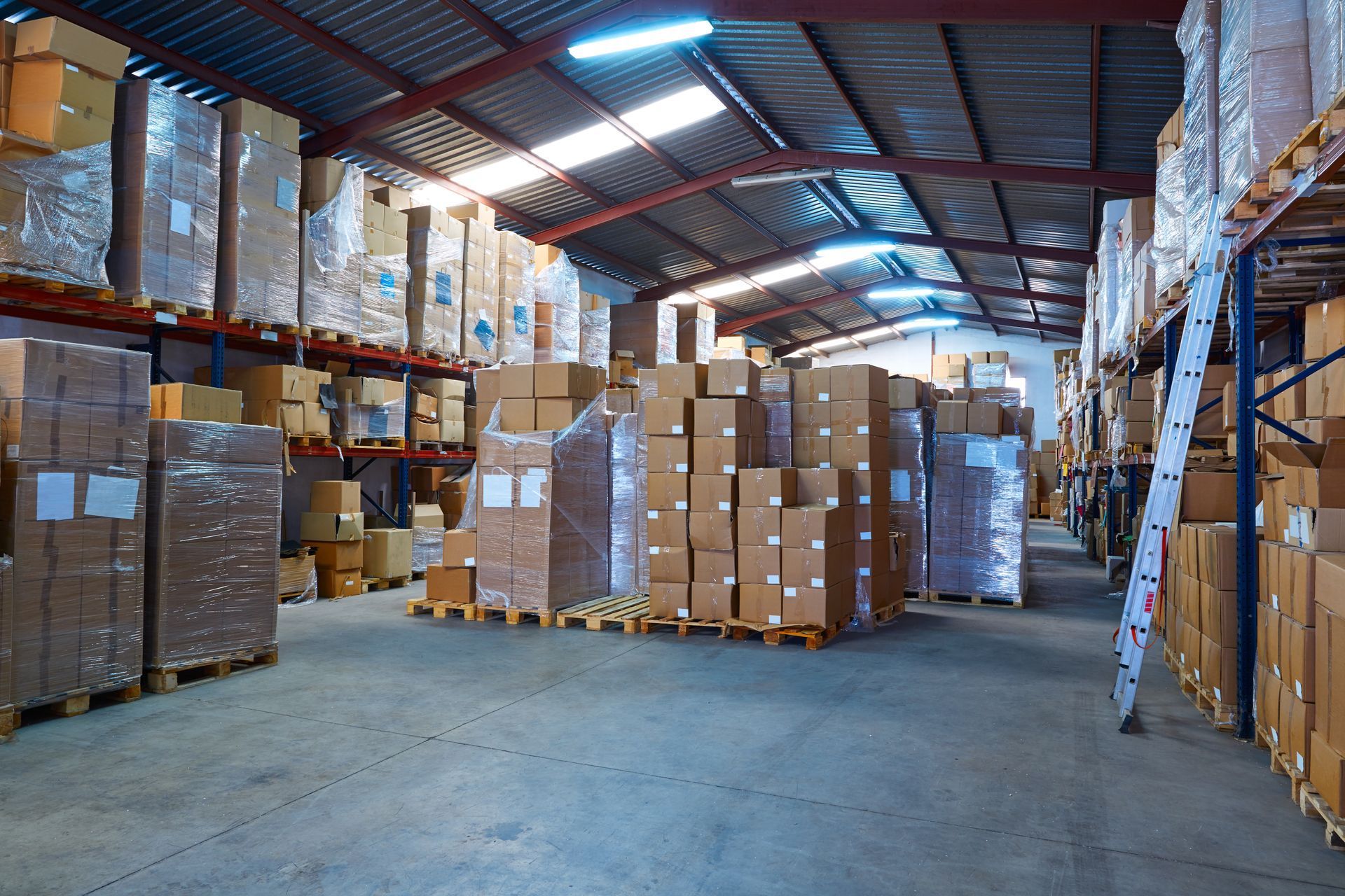 A large warehouse filled with lots of boxes and shelves