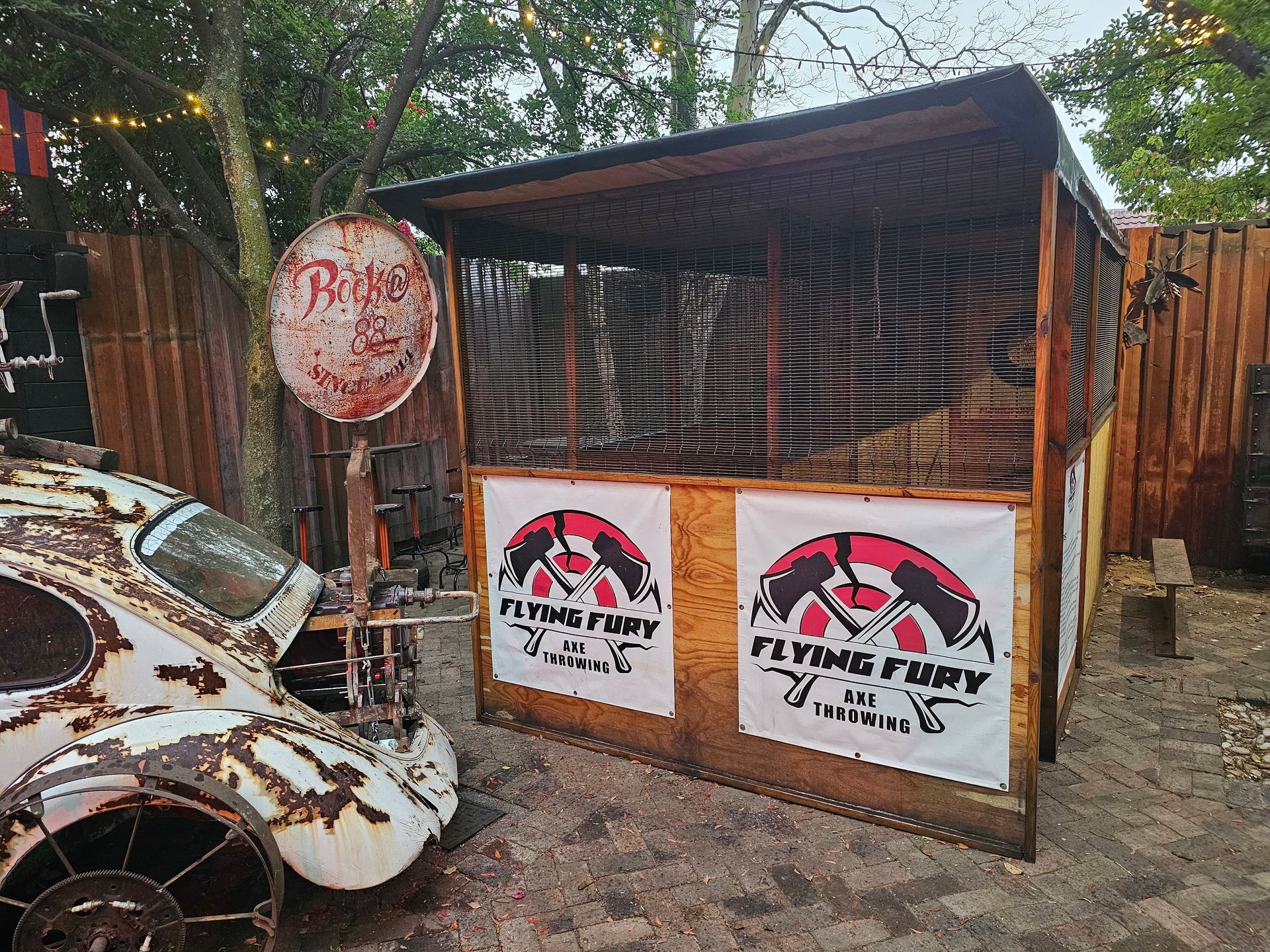 A rustic outdoor booth with two 