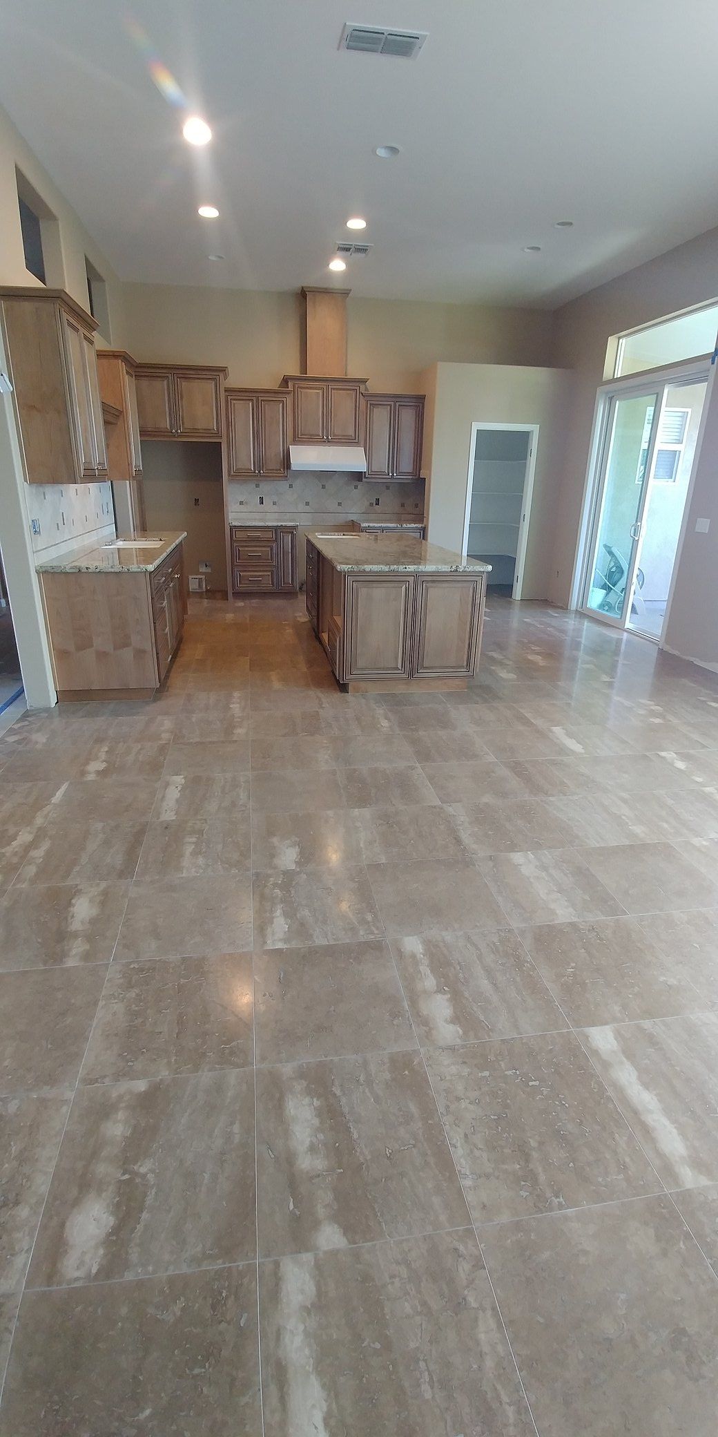 A kitchen with a large island in the middle of the room.