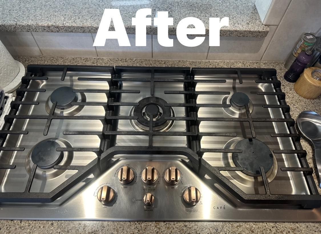 A stainless steel stove top oven is sitting on top of a granite counter.