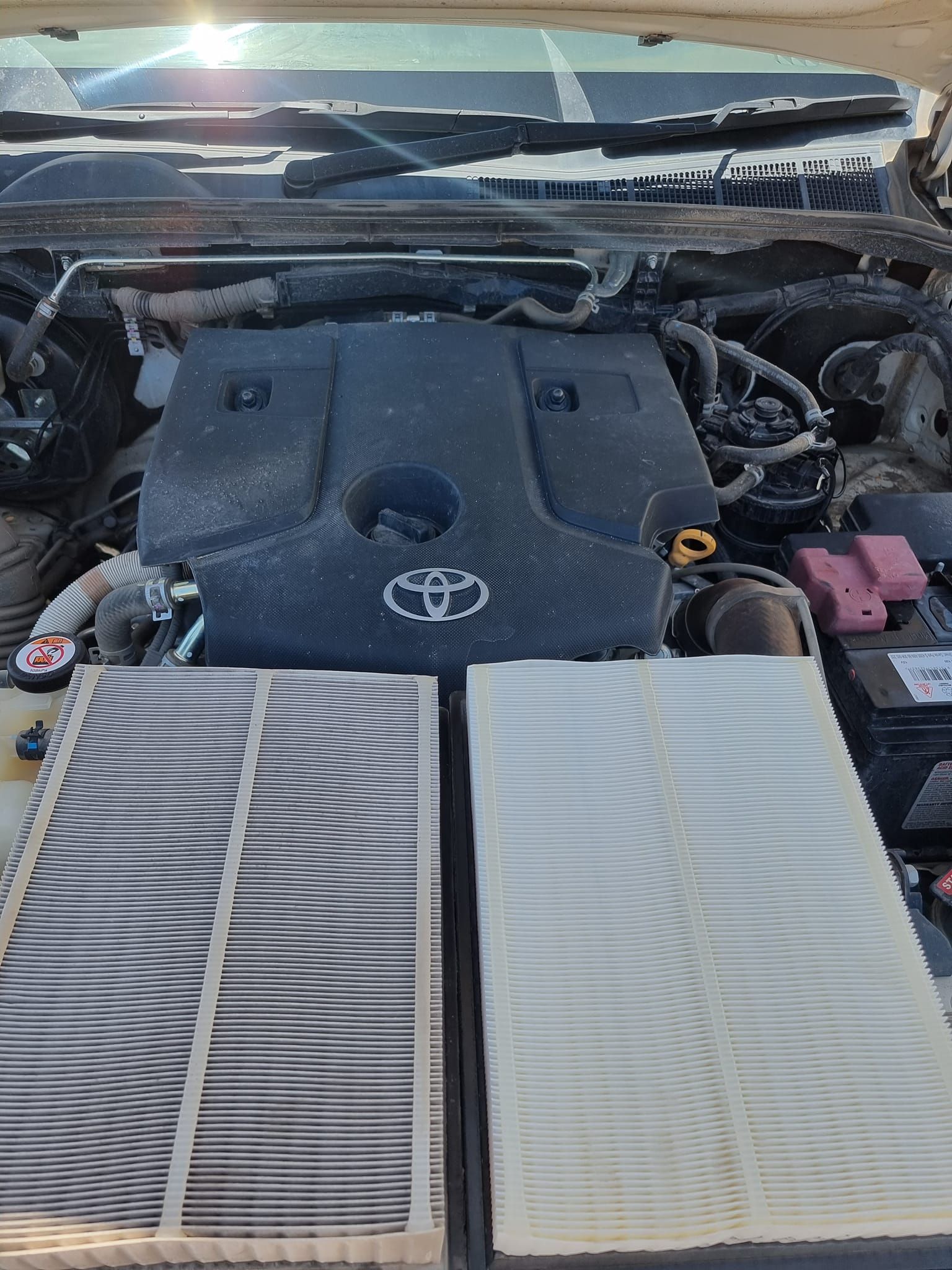 Engine Bay of a Toyota Vehicle Showing a Dirty Used Engine — Dynamic 4X4 Off Road Performance & Mechanical in Garbutt, QLD