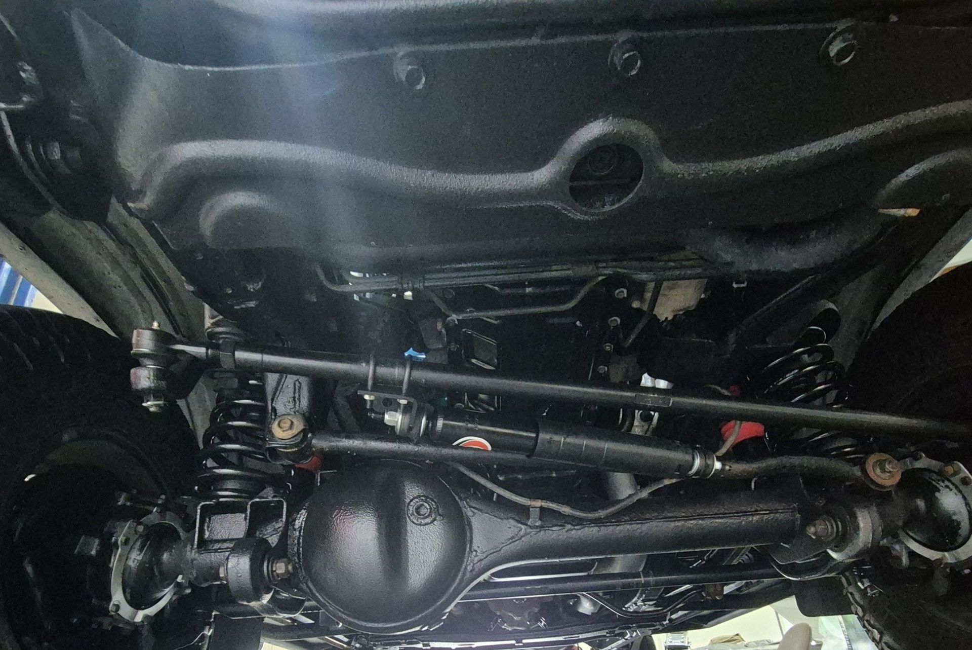 A Close-up View of the Clean, Black Undercarriage — Dynamic 4X4 Off Road Performance & Mechanical in Garbutt, QLD