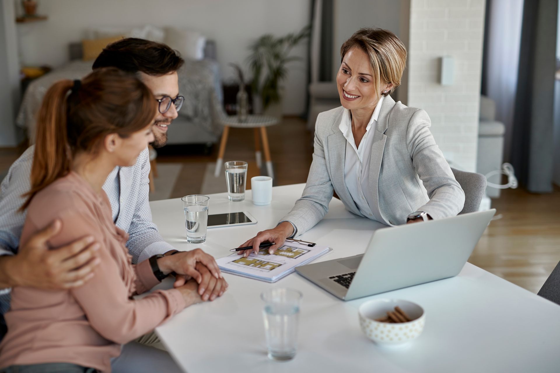 A real insurance agent shows a couple documents