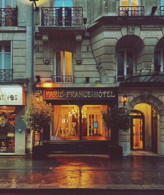 Elegant Parisian boutique hotel facade on a Haussmann street