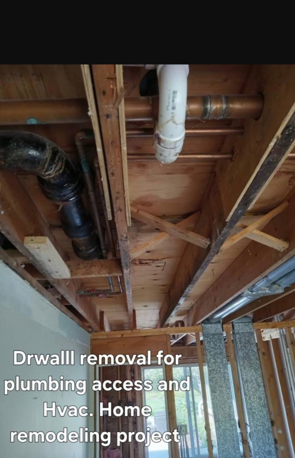 Exposed ceiling joists and ducts during drywall removal for plumbing and HVAC access in a home remodel.