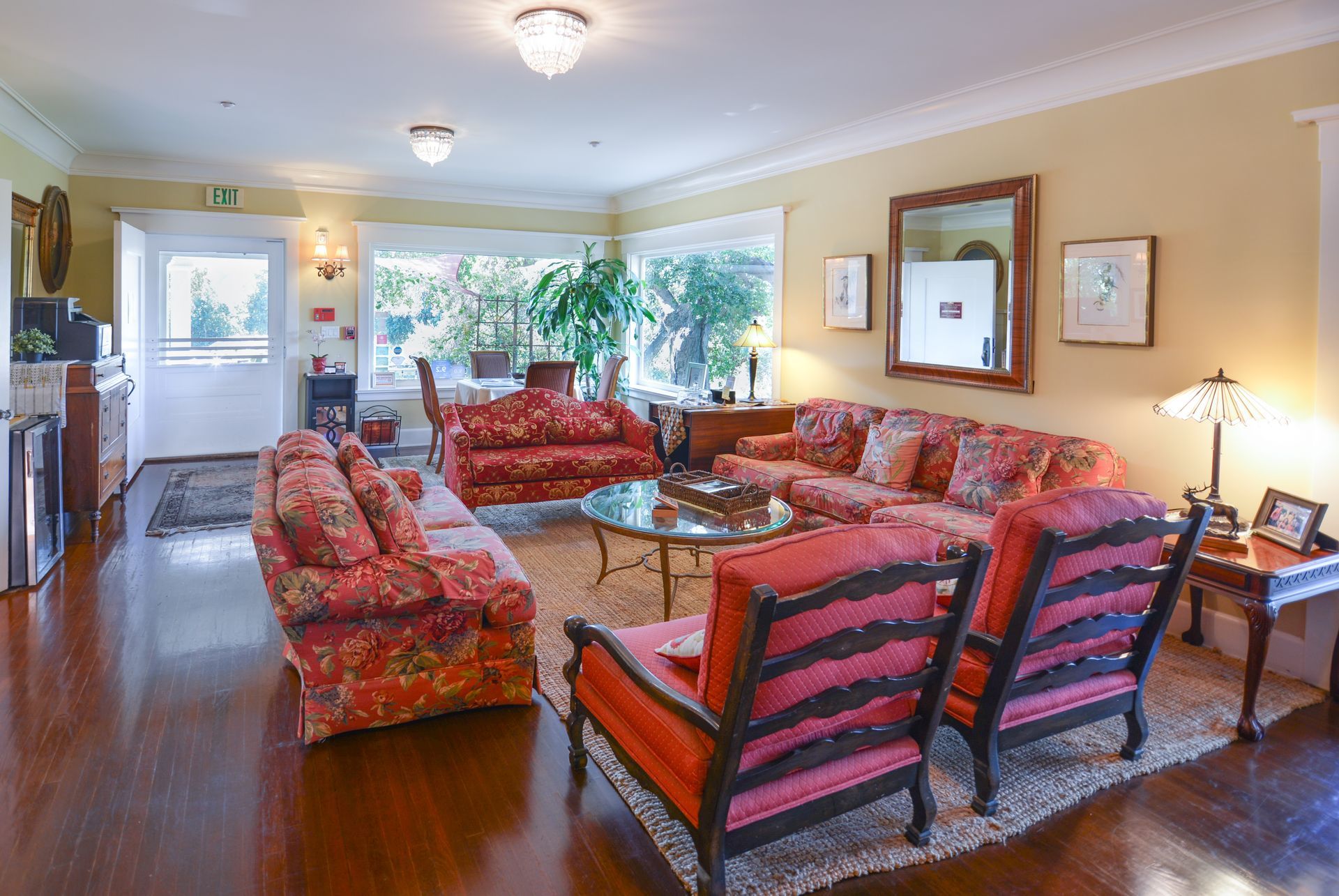 A living room filled with furniture and a large window.