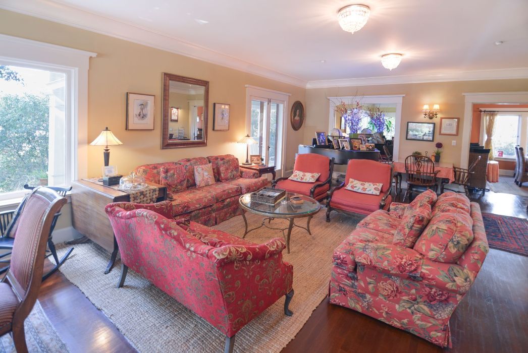A living room filled with furniture and a large window