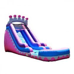A pink and blue inflatable water slide with a crown on top.
