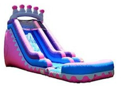 A pink and blue inflatable water slide with a crown on top.