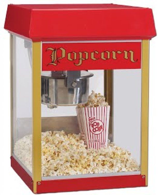 A red and gold popcorn machine filled with popcorn