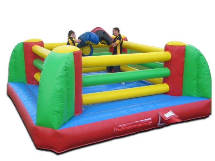 Two people are playing in an inflatable boxing ring