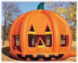 A large inflatable pumpkin is sitting on the ground