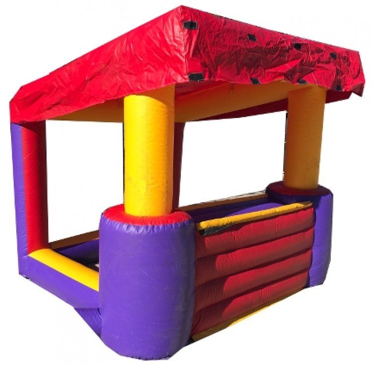 A colorful inflatable house with a red roof