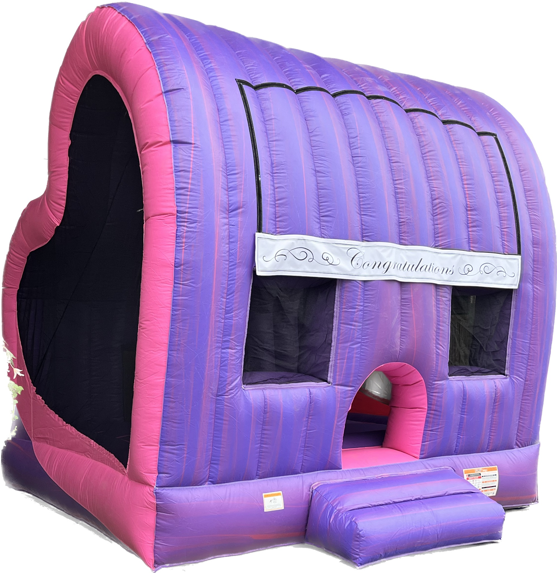 A purple and pink bouncy house in the shape of a heart