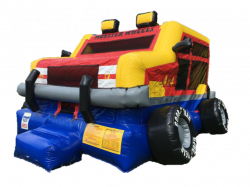 A red , yellow and blue bouncy house in the shape of a monster truck.
