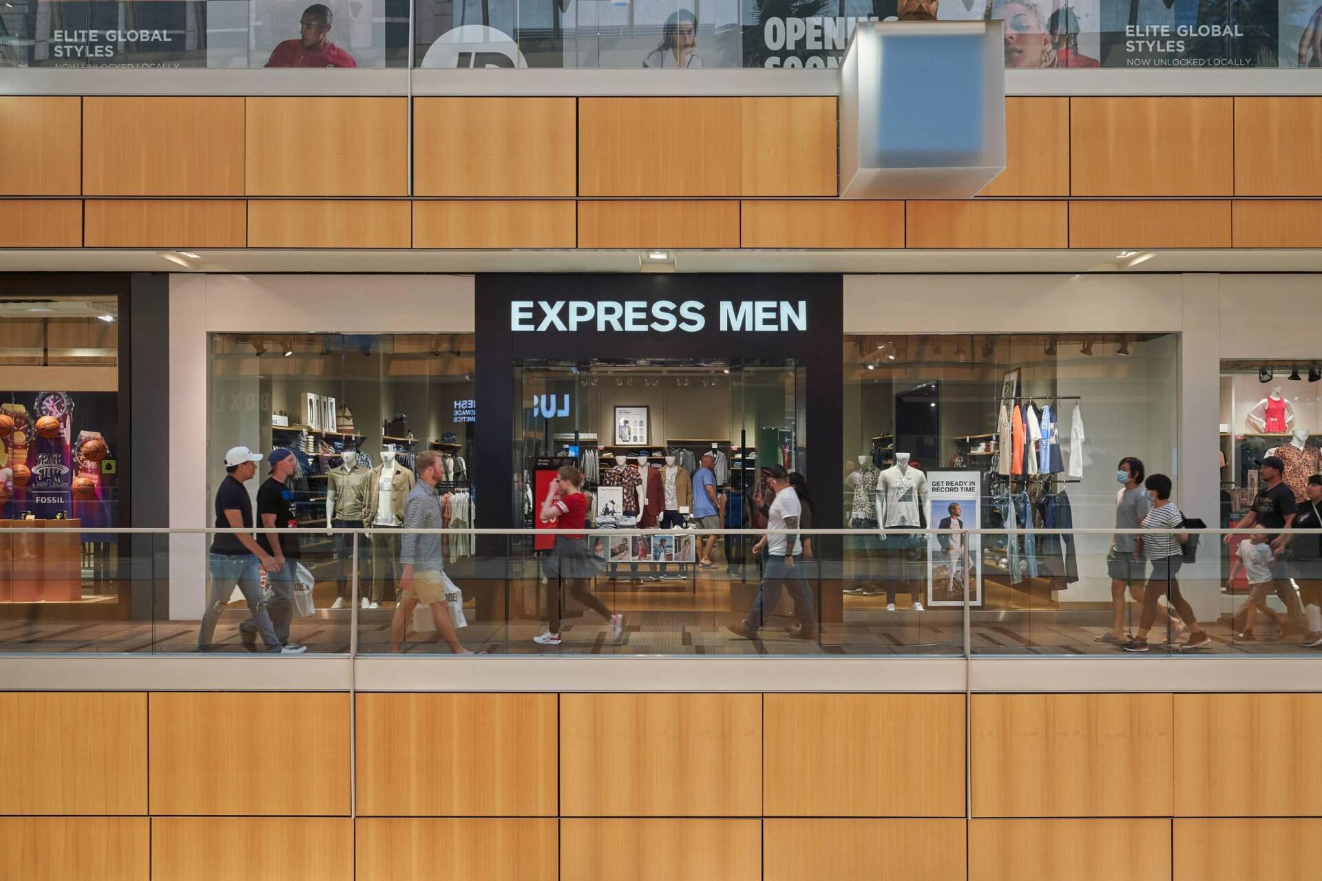 Express Men store in a shopping mall with people walking by.