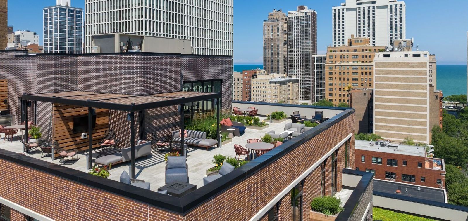 An aerial view of a rooftop terrace with a view of a city.