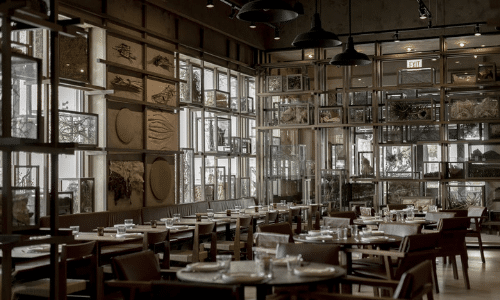 A restaurant filled with tables and chairs and lots of windows.