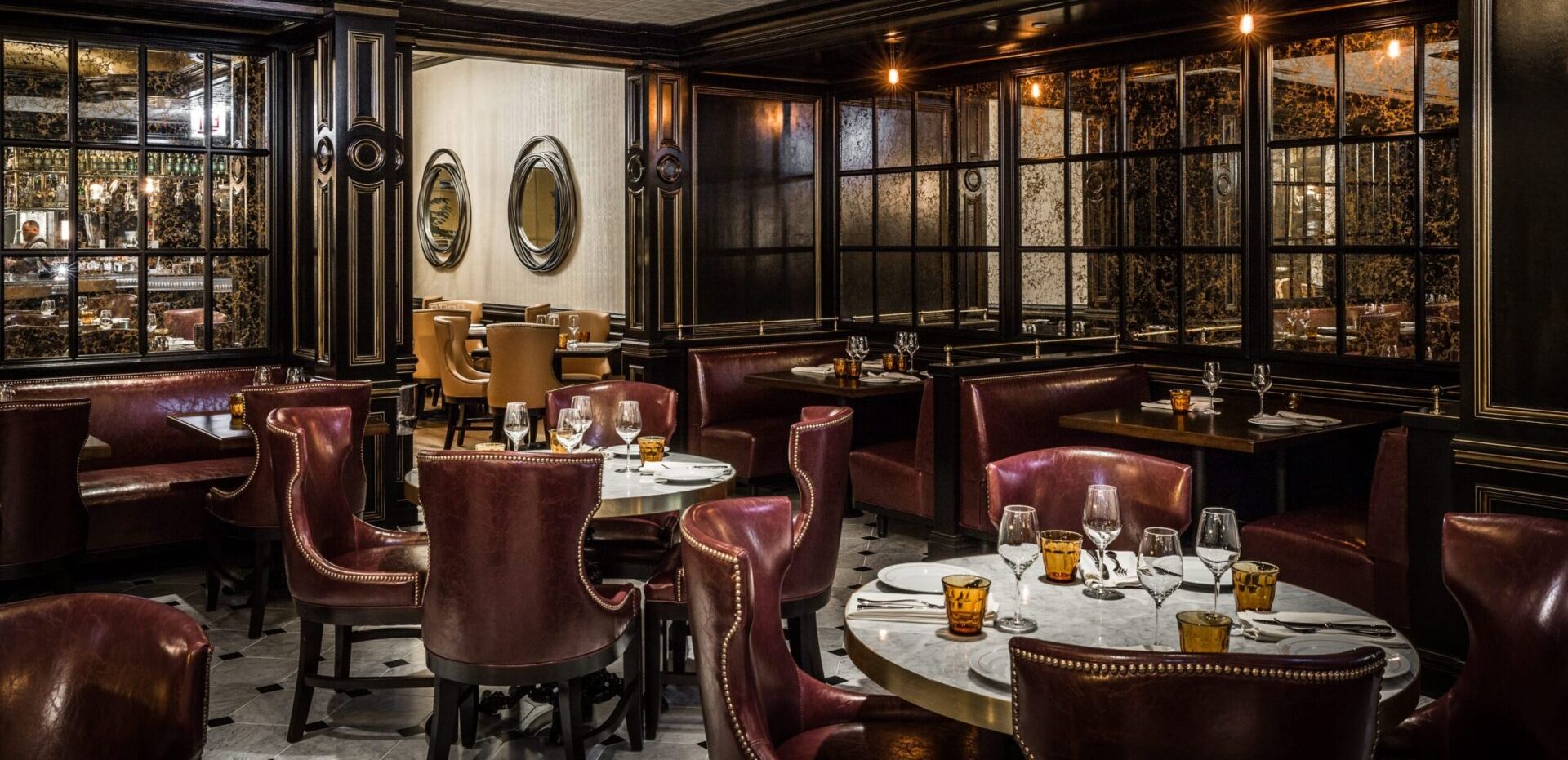 There are many tables and chairs in the restaurant.