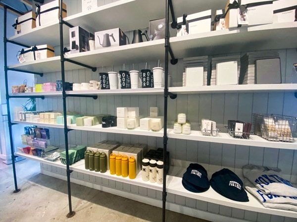 A store filled with lots of items including candles and hats.
