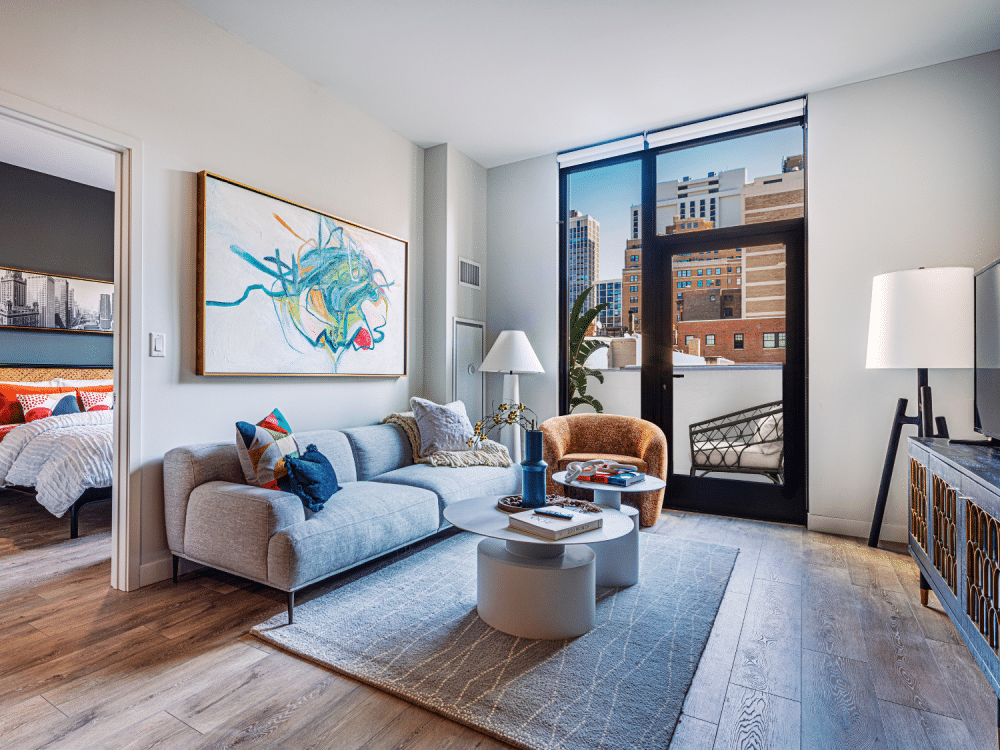 Modern living room with furniture and exit to the balcony at Gild Apartment.