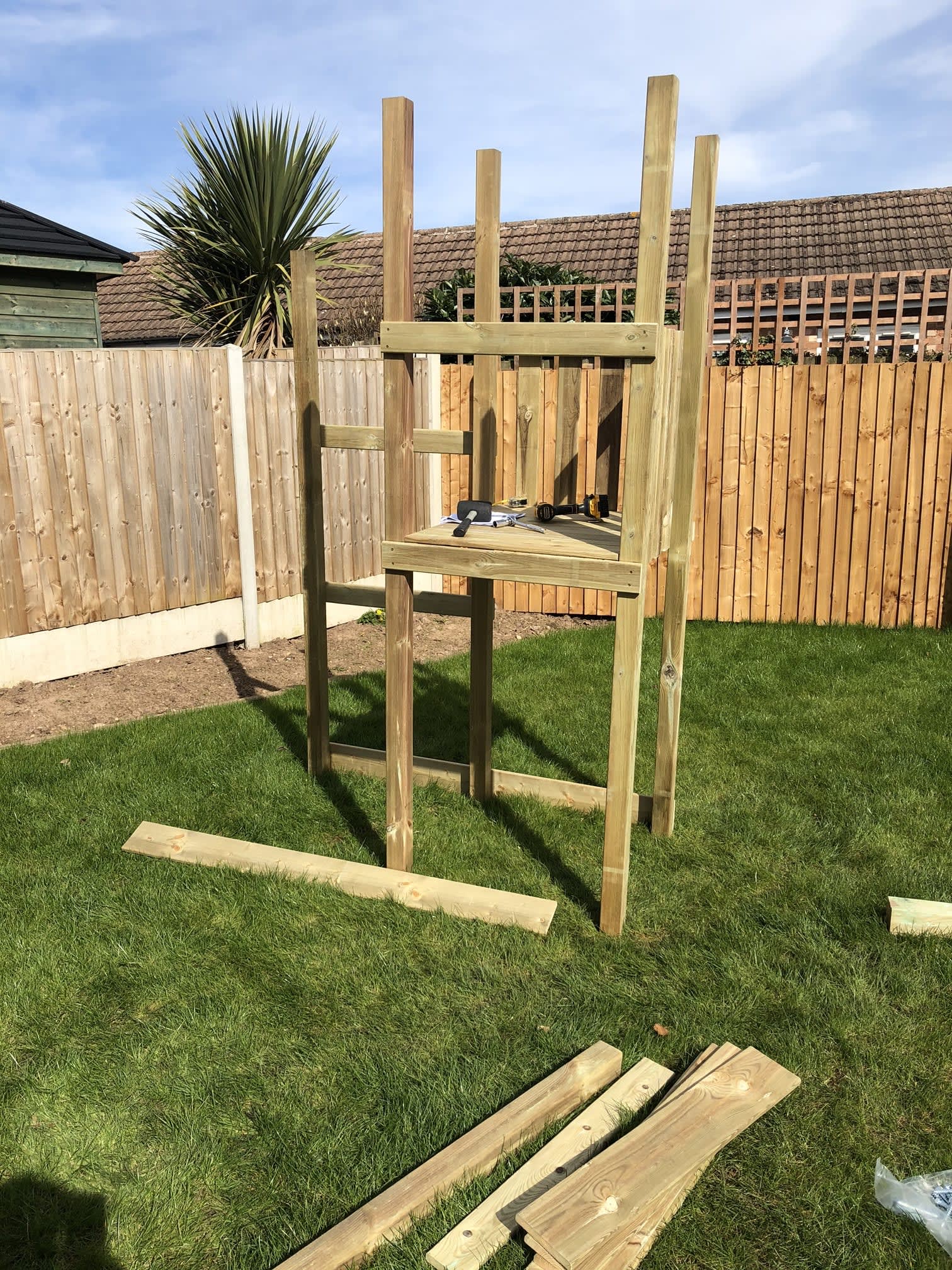 Children's play area in garden being assembled