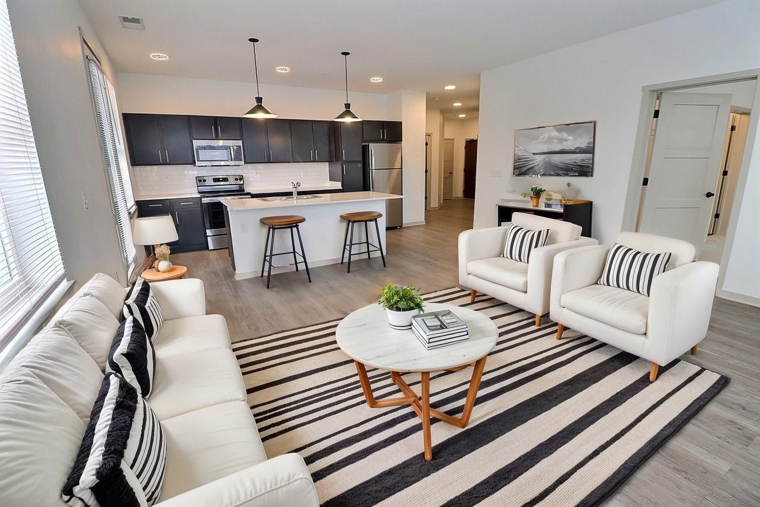 Livingroom with view of kitchen and kitchen island