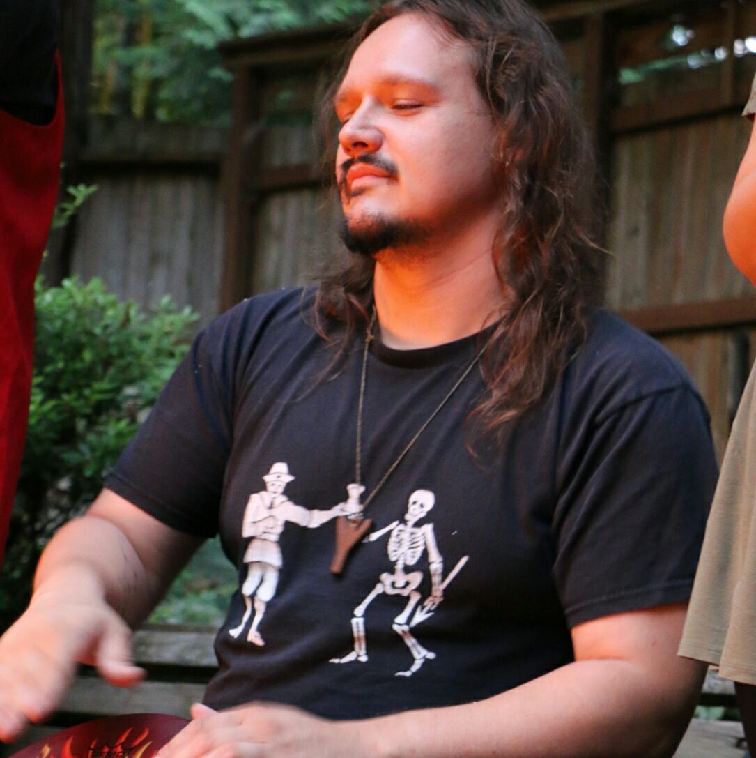 A man wearing a black shirt, The High Archpreist of 