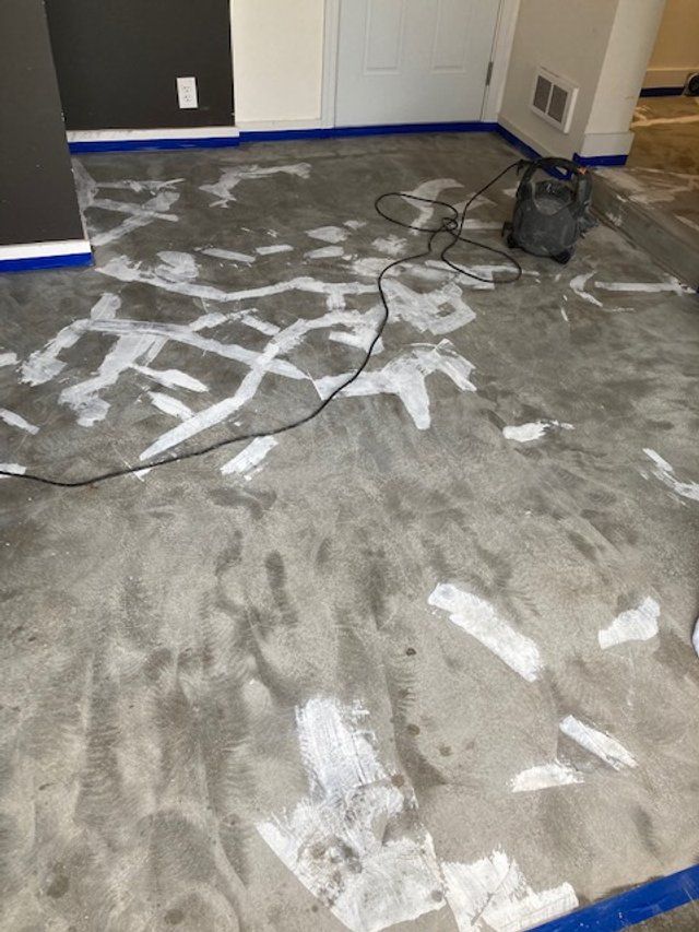 A vacuum cleaner is sitting on the floor of a room.