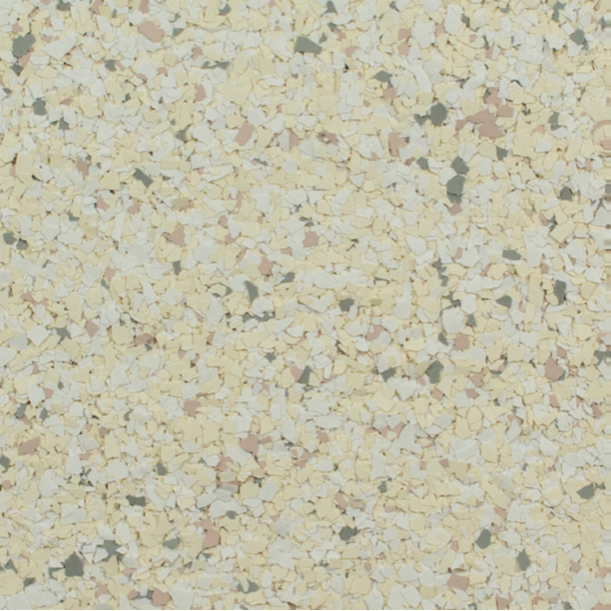 Close-up of speckled flooring with pale yellow, pink, and dark grey flecks.